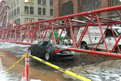 Photo of tower crushing a car